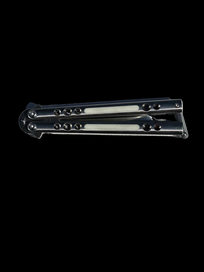 BaliBalistic ported and white G10 inlaid 1/2 inch thick titanium channel cut handles with a latch that are paired up to a Bowie clip point blade