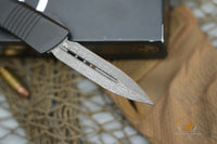 Microtech 138-16S Signature Series Troodon AUTO OTF 3.06" Damascus Double Edged Dagger Blade, Black Aluminum Handles