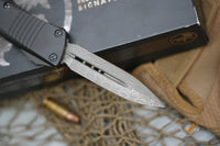 Microtech 138-16S Signature Series Troodon AUTO OTF 3.06" Damascus Double Edged Dagger Blade, Black Aluminum Handles
