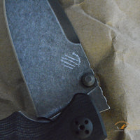 Bastinelli Creations Red IKBS Frame Lock Folding Knife 3.4" M390 Black PVD Stonewashed Drop Point Blade, Milled Black G10 Handle