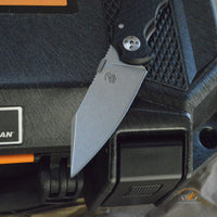 Bastinelli Creations D Vil Mini Dragotac Folding Knife 2.875" M390 Stonewashed Wharncliffe Blade, 3D Machined Black G10 and Bronze Titanium Handles