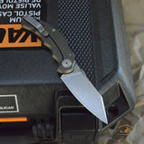 Bastinelli Creations D Vil Mini Dragotac Folding Knife 2.875" M390 Stonewashed Wharncliffe Blade, 3D Machined Black G10 and Bronze Titanium Handles