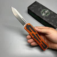 Heretic Knives Colossus OTF AUTO 3.5" CPM-MagnaCut Stonewashed Clip Point Combo Blade, orange Aluminum Handles
