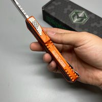 Heretic Knives Colossus OTF AUTO 3.5" CPM-MagnaCut Stonewashed Clip Point Combo Blade, orange Aluminum Handles