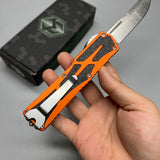 Heretic Knives Colossus OTF AUTO 3.5" CPM-MagnaCut Stonewashed Clip Point Combo Blade, orange Aluminum Handles