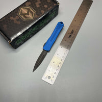Heretic Knives Manticore S OTF AUTO 2.55" CPM-MagnaCut Black DLC Double Edge Dagger Blade, Blue Aluminum Handle with Blue CamoCarbon Top - H024-6A-BLU/CF