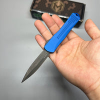 Heretic Knives Manticore S OTF AUTO 2.55" CPM-MagnaCut Black DLC Double Edge Dagger Blade, Blue Aluminum Handle with Blue CamoCarbon Top - H024-6A-BLU/CF